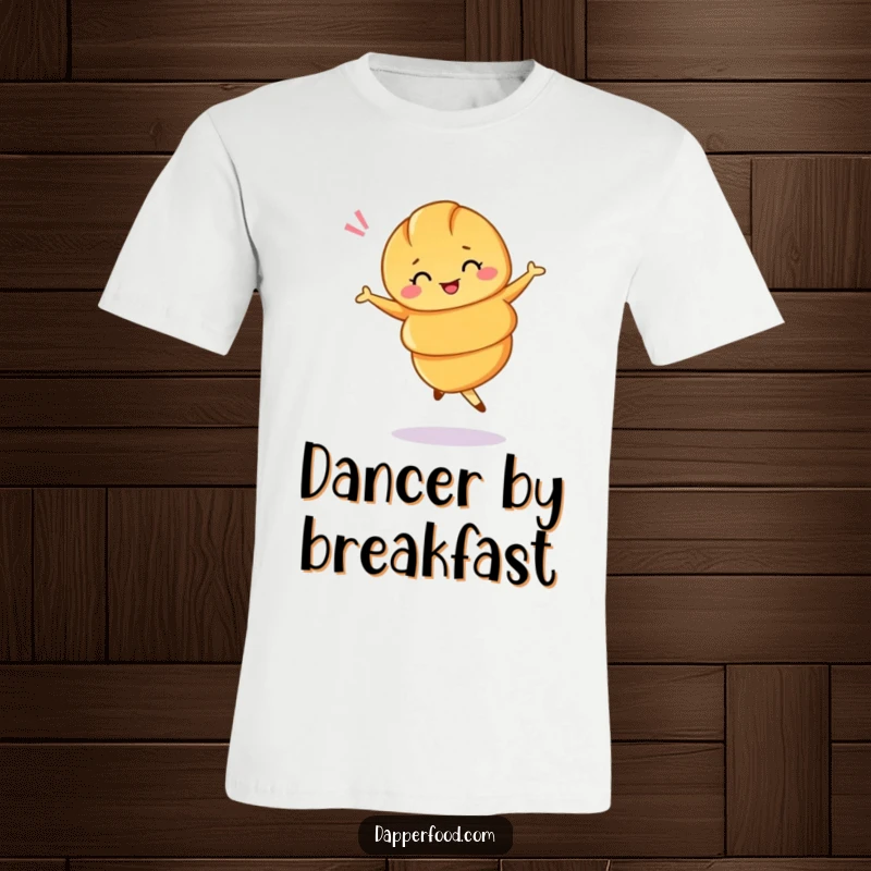 Funny t-shirt featuring a croissant in a ballet twirl, winking playfully. A delicious statement piece.